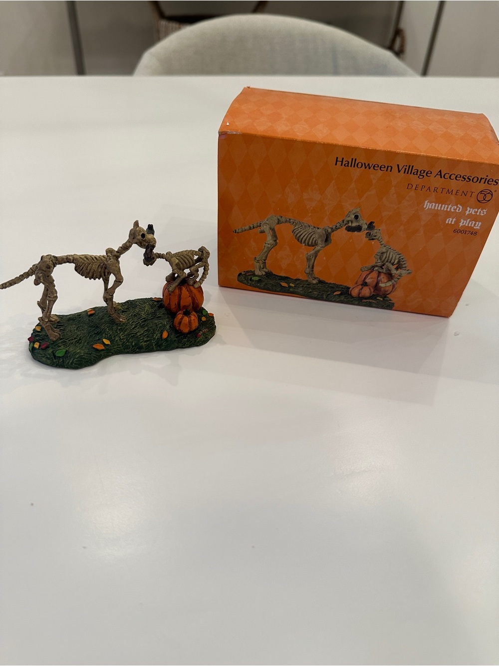 Department 56 Skeleton Dogs with Orange Pumpkins on Green Base